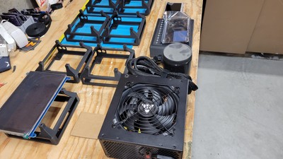 With the holsters printed up and the power supply in hand, it's time to start bench fitting the parts to see how much space we actually have to work with. Notice the cardboard cutouts used as placeholders - whatever works works!