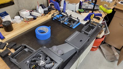 In-flight test fitting and drilling of the printed holsters. Using painter's tape during assembly and drilling reduces the amount of splintering on the surface of the wood. No making fun of using a random tile piece for a straight edge!