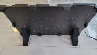 The backside of Labinator showing the hidden screw points and fasteners that attach each piece of gear to the board.